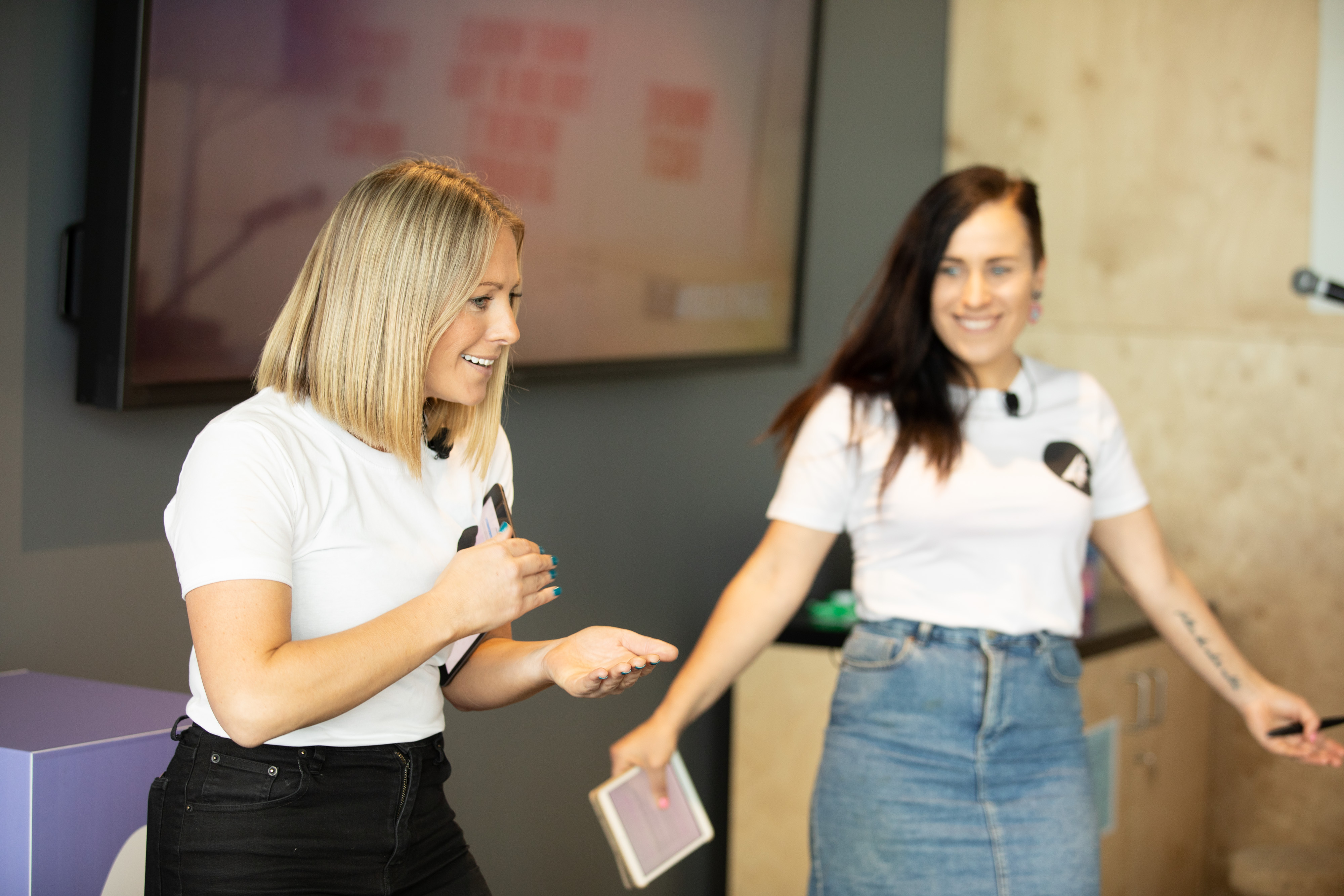 Rosie and Lucy delivering keynote speech