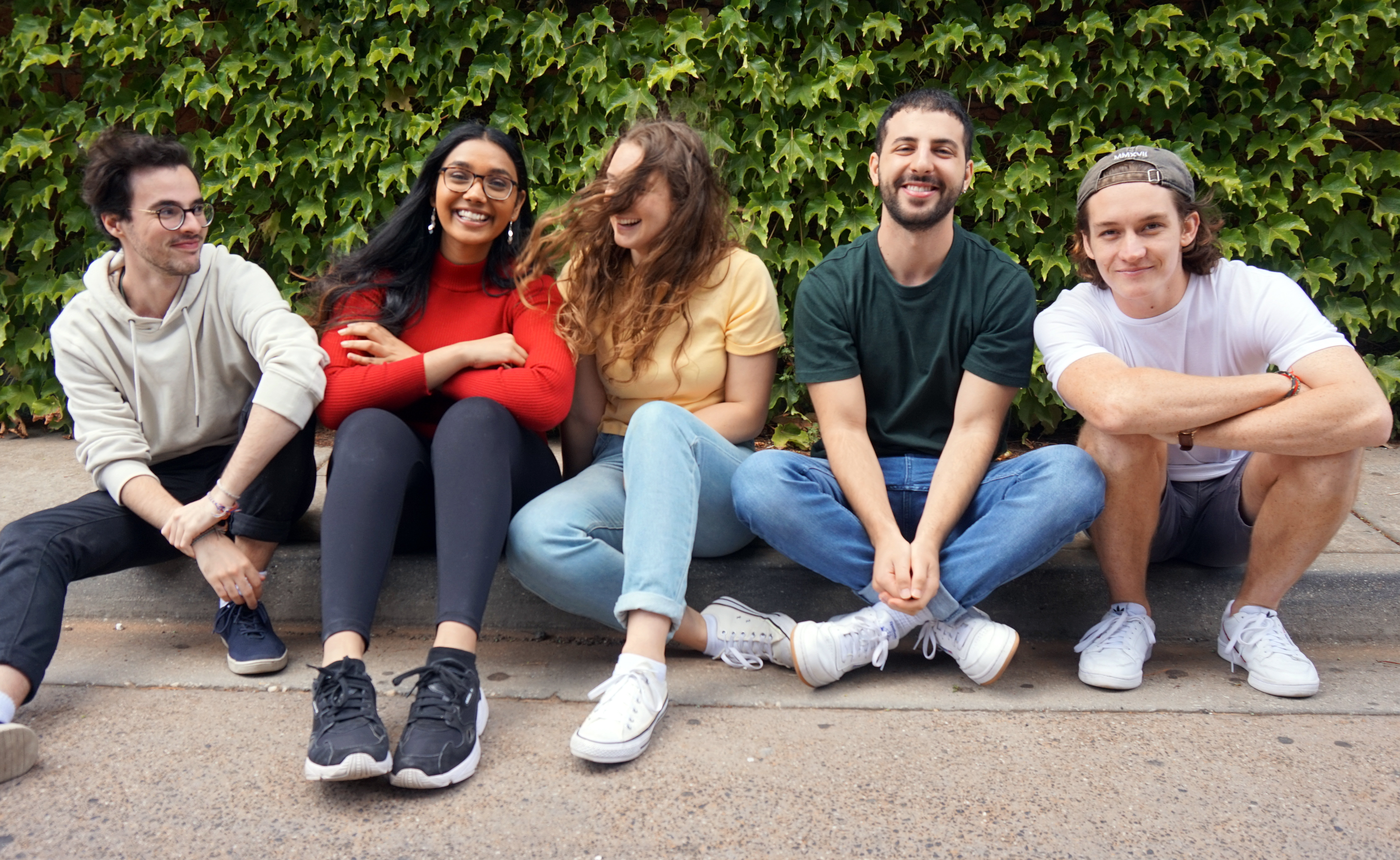 Presenters sitting on the curb together