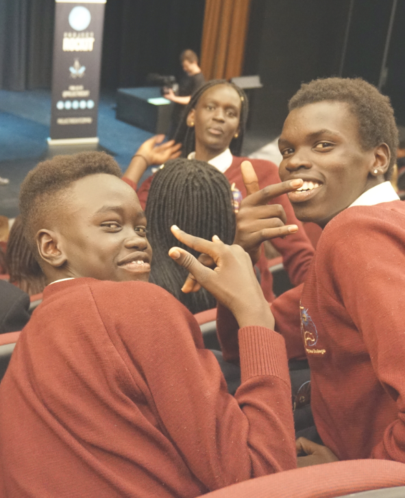 Group of BIPOC students in a school auditorium