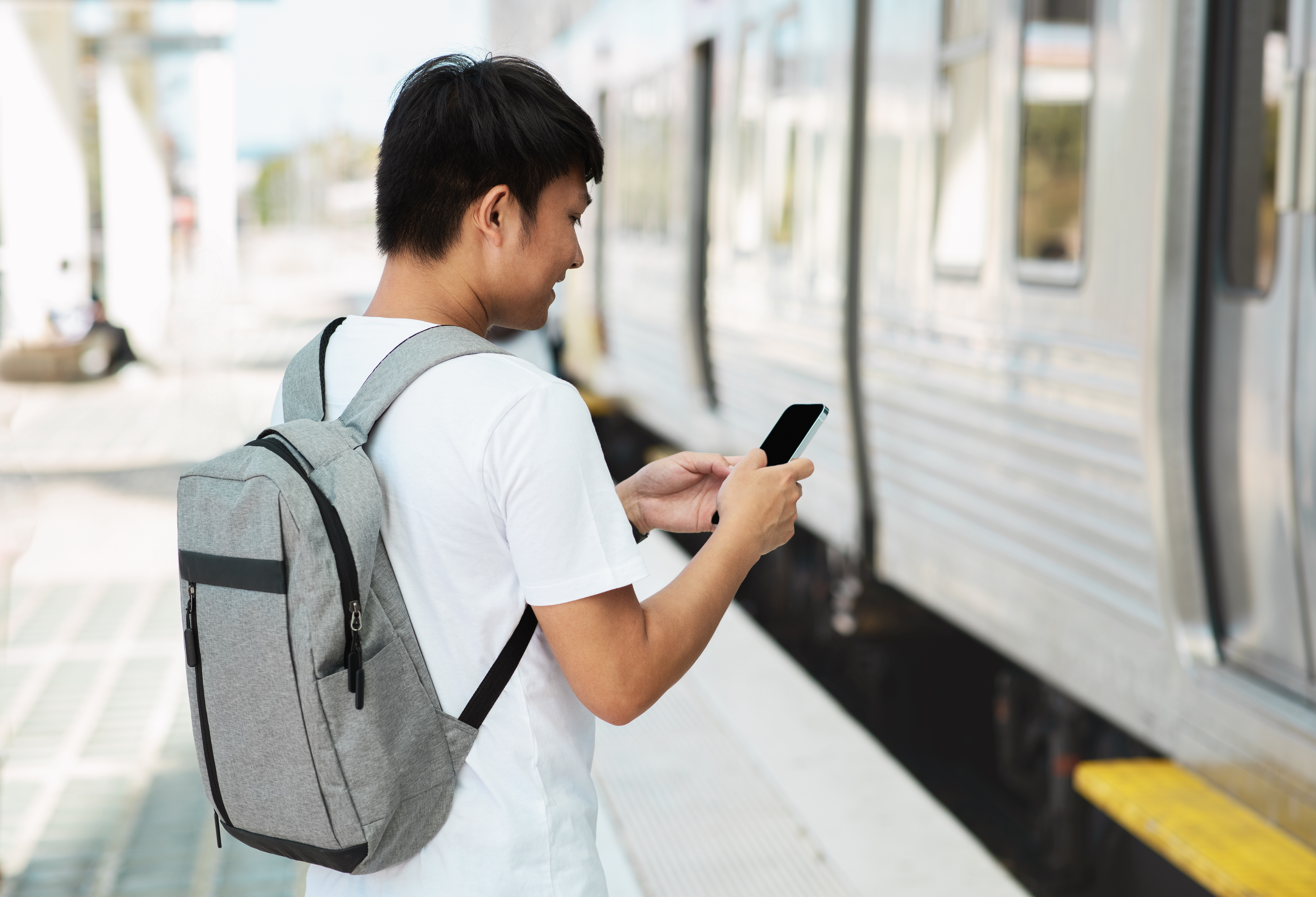 Asian guy student using smartphone standing by tr 2025 03 18 16 07 09 utc